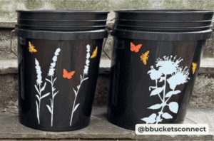 two black mosquito buckets with white wildlife graphics