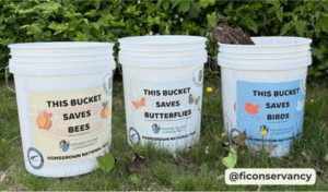 three white mosquito buckets with wildlife signs
